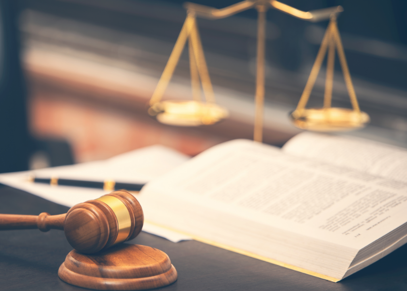 gavel, book, and justice scales on desk gavel, book, and justice scales on desk